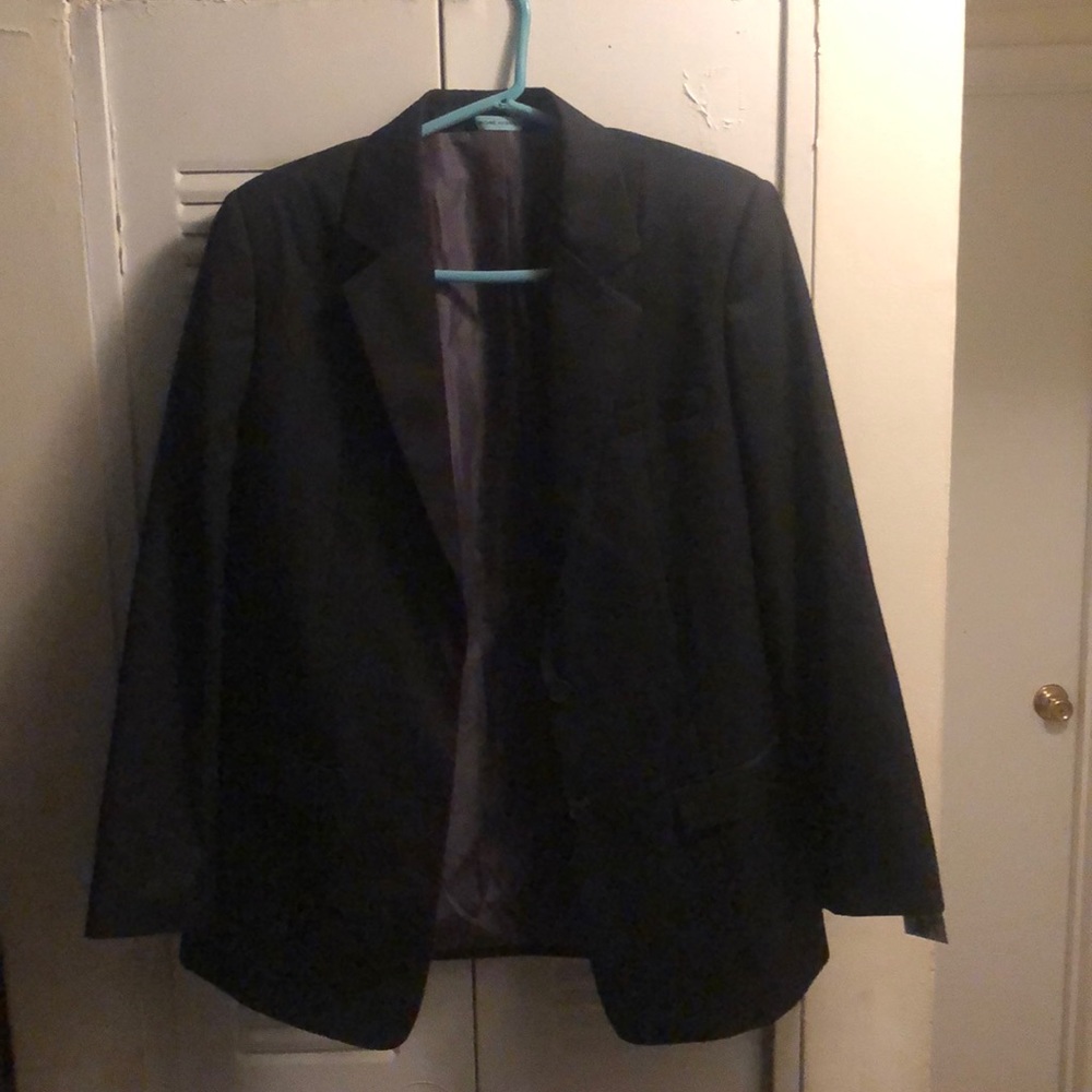 An Exclusive, unused blazer with shoulder pads
